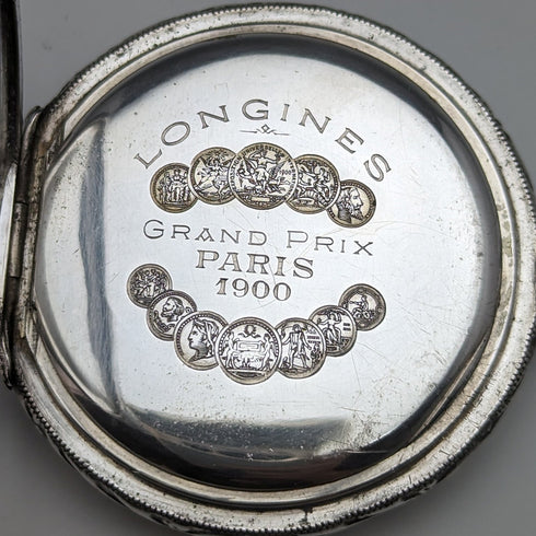 Around 1910 Antique Longines pocket watch Embossed female sculpture Silver side hunter Works well