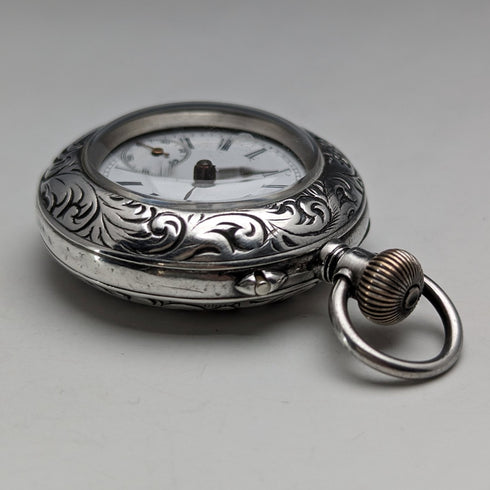 Circa 1900 Antique Swiss made small pocket watch Engraved silver side case Good working condition