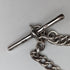 Circa 1900 British antique sterling silver Albert chain, 56g, large two-tone rotating fob
