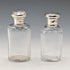 Circa 1900 British antique sterling silver screw-top glass bottle pair