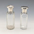 Circa 1900 British antique sterling silver screw-top glass bottle pair