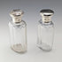 Circa 1900 British antique sterling silver screw-top glass bottle pair