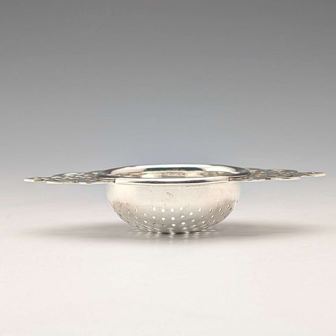 Vintage British silver plate tea strainer