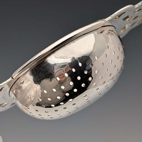 Vintage British silver plate tea strainer