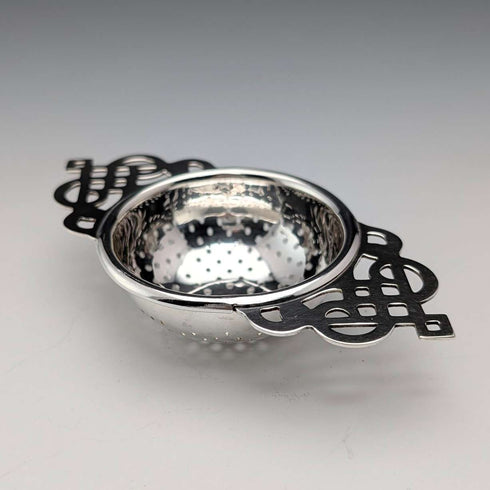 Vintage British silver plate tea strainer