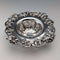 Antique American sterling silver tea strainer with floral decoration