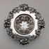 Antique American sterling silver tea strainer with floral decoration