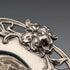 Antique American sterling silver tea strainer with floral decoration