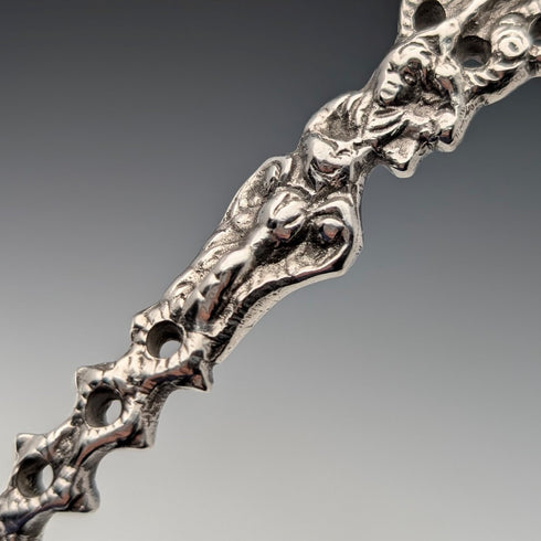 1904 British antique sterling silver large spoon with relief decoration by Samuel Boyce