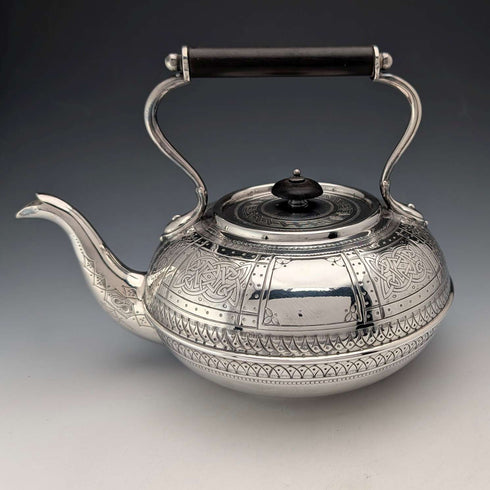 Antique British silver plated tea kettle with Celtic carvings