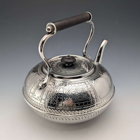 Antique British silver plated tea kettle with Celtic carvings