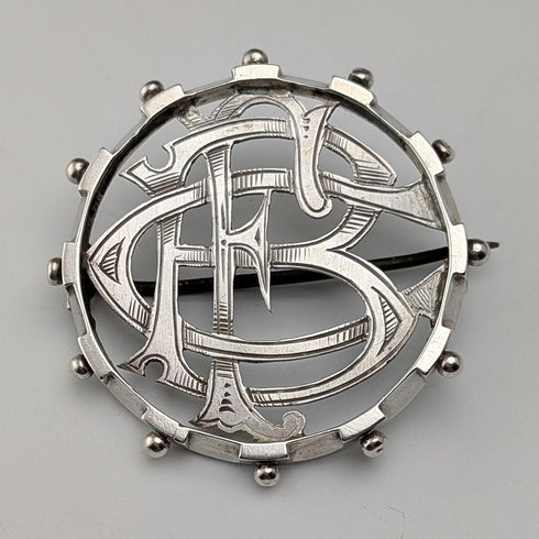 Antique sterling silver monogrammed round brooch