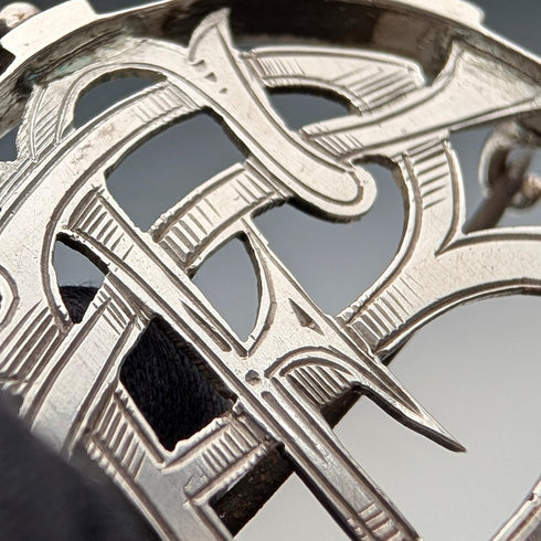 Antique sterling silver monogrammed round brooch