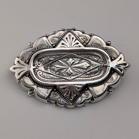 1880 British antique sterling silver finely engraved oval brooch by Alfred George Griffiths