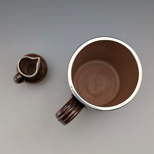 Circa 1900 British antique sterling silver decorated ceramic mug and mini cream jug Mappin & Webb
