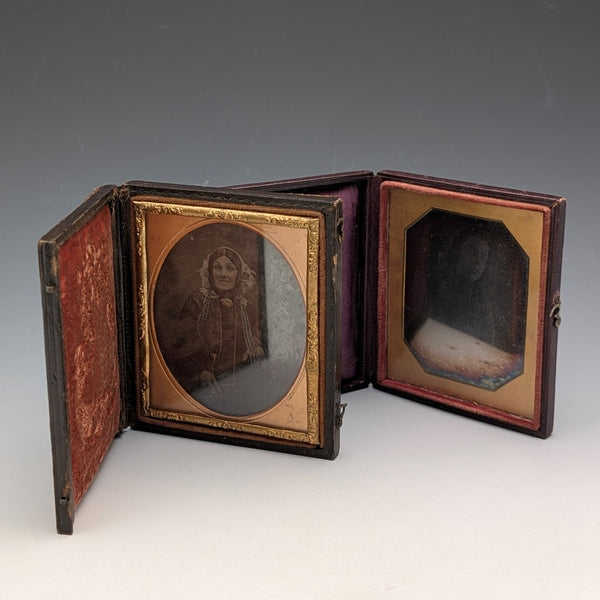 Pair of antique daguerreotypes in leather-covered cases