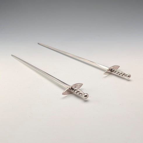 Antique British silver plate sword-shaped meat skewers pair by William Hutton & Sons