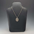1977, UK, sterling silver, oval pendant with sterling silver necklace, total weight 22.4g