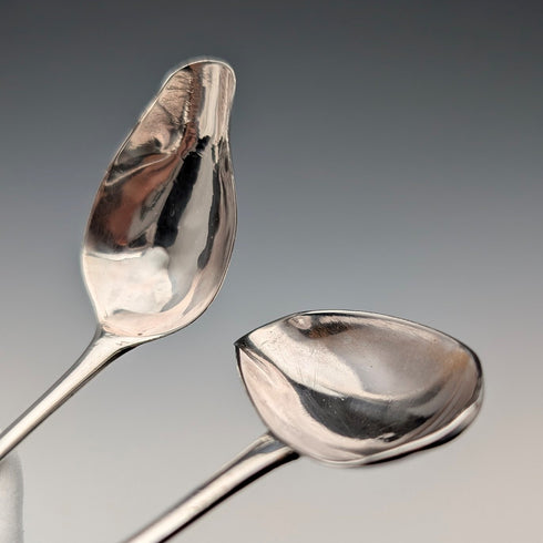 Pair of antique British sterling silver baby feeder spoons, total weight 22g.