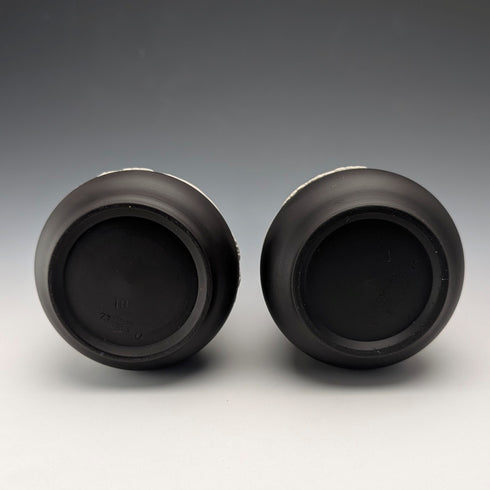 A pair of vintage British Wedgwood black jasperware vases.
