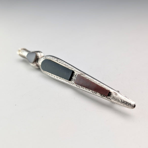 Antique British sterling silver brooch with three colored stones and a Scottish dark finish.