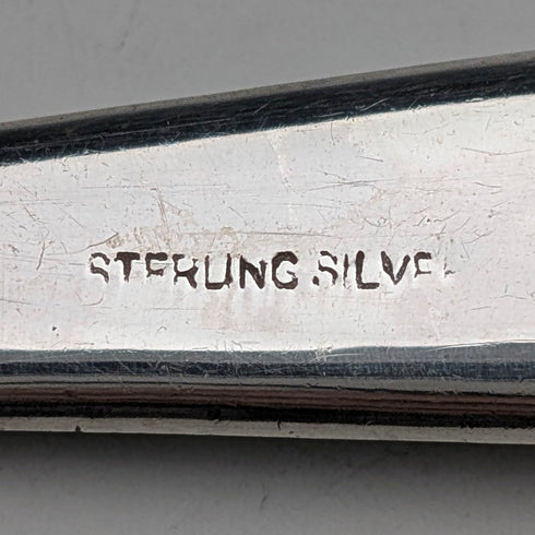 Antique British sterling silver brooch with three colored stones and a Scottish dark finish.