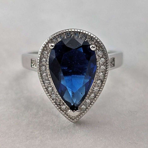 Vintage sterling silver drop-shaped blue cubic zirconia ring (size 12)
