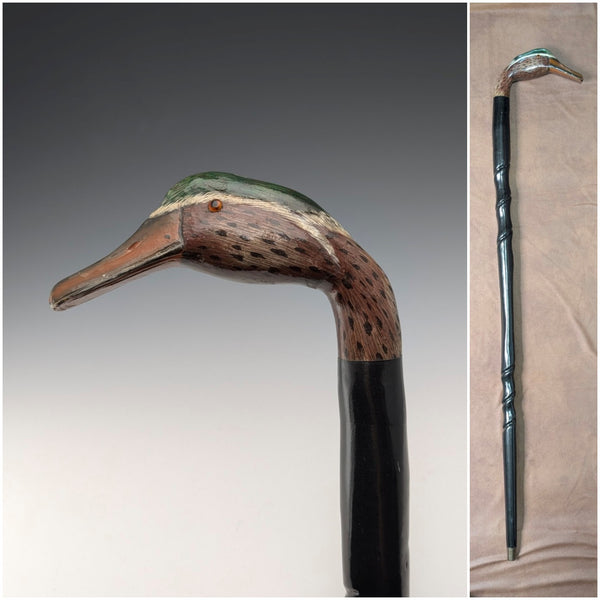 British vintage twisted black shaft walking stick with painted duckhead handle, 94cm