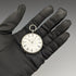 Reloj de bolsillo antiguo para dama, de fabricación suiza, en buen estado de funcionamiento, con caja de plata con grabado floral y cuerda por llave.