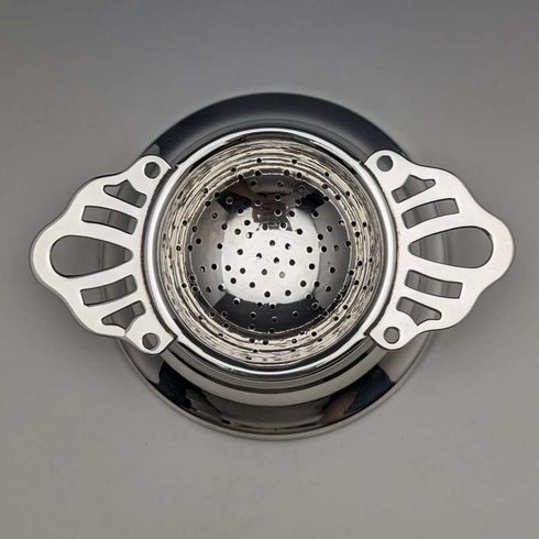 British vintage silver plate tea strainer