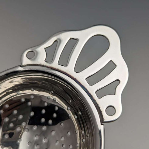 British vintage silver plate tea strainer