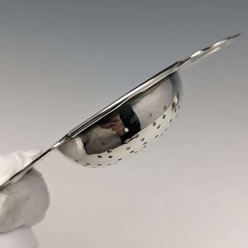 British vintage silver plate tea strainer