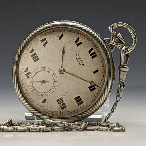 Reloj de bolsillo Cyma vintage, mecánico, caja plateada, en buen estado de funcionamiento, con cadena.