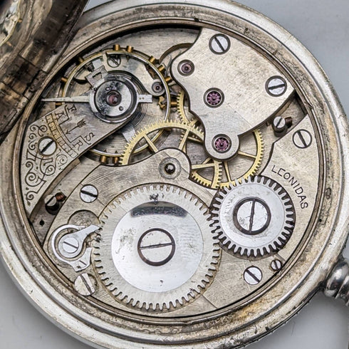 Swiss made antique Leonidas pocket watch flower sculpture silver side hunter case works well