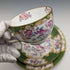 First half of the 20th century British Minton Teacup Trio Cockatrice Green with translation